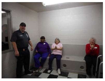 Sergeant Brigman brings Dayspring of Wallace residents Minnie Newkirk, Mary Caison and Louise Hatcher on a tour of the Wallace Police Department headquarters