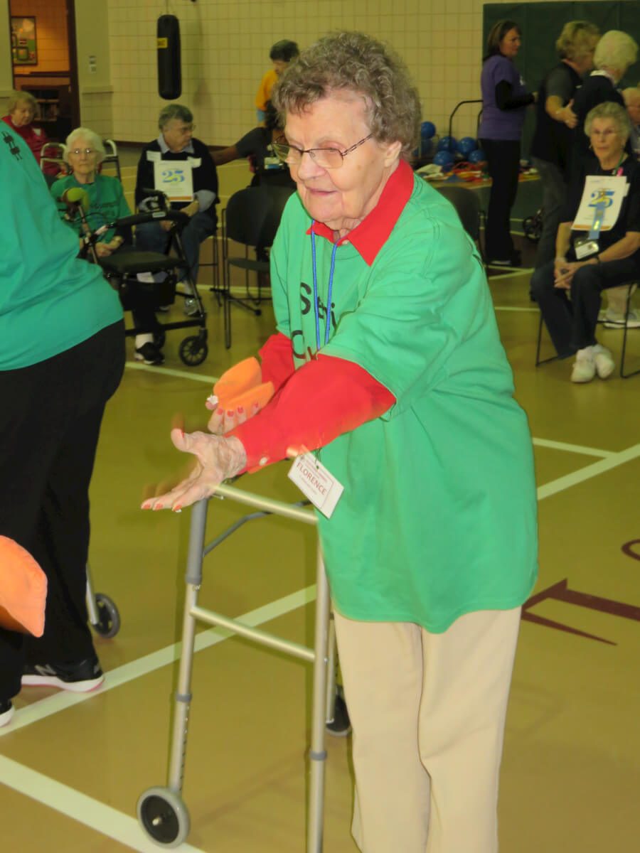 DePaul Westwood Commons resident Florence Vancott tries her hand at the bean bag toss