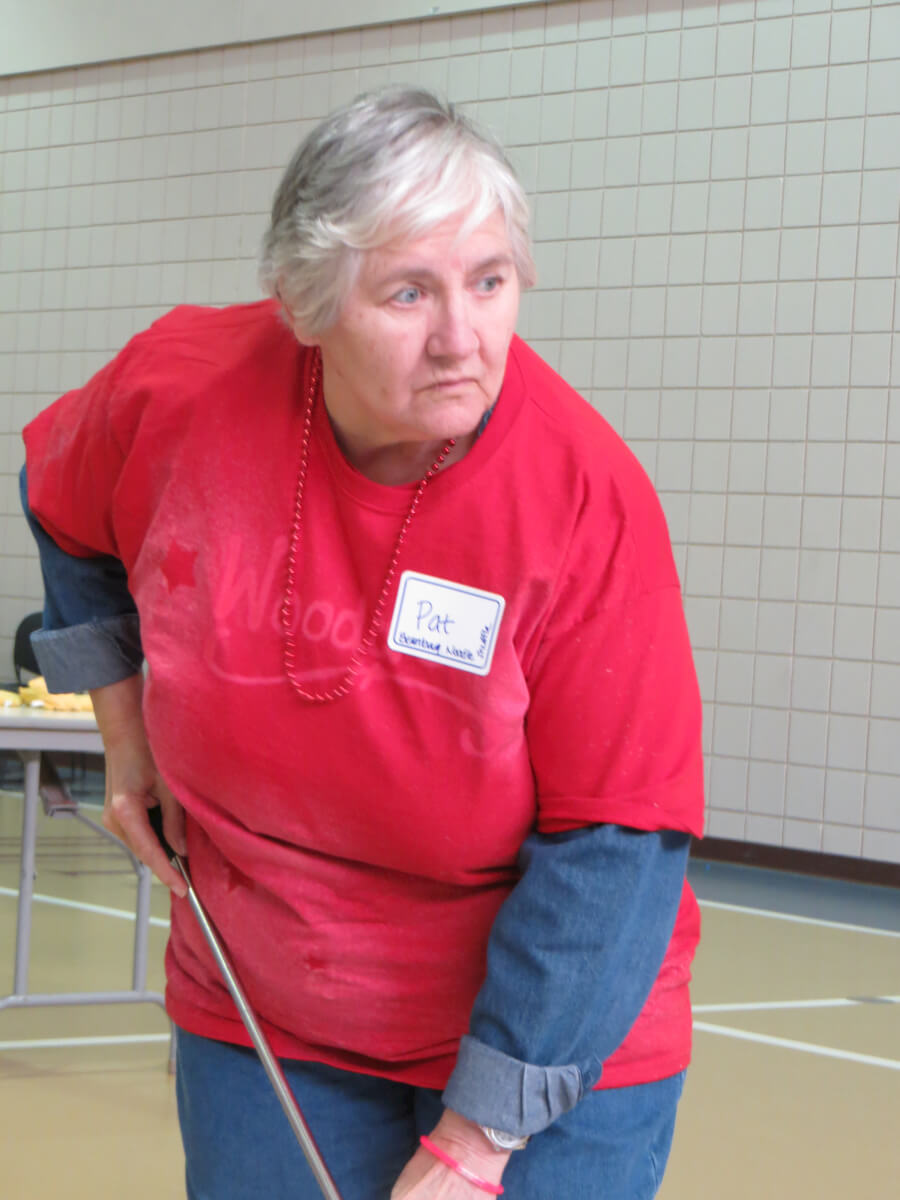 Patricia Budd participates in shuffleboard during DePaul’s ninth annual Senior Olympics.
