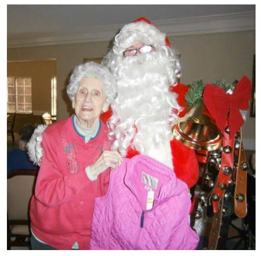 Santa Claus is pictured here with Cambridge House resident Helen Byers.