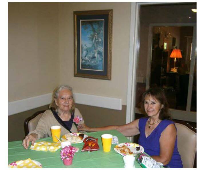 Cambridge House resident Iva Martin, pictured with her daughter Joyce Jaeger eating on Mother's Day