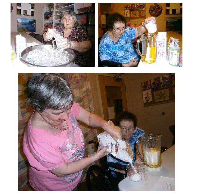 Cambridge House residents measuring ingredients to make summer treats