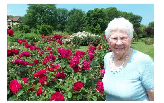  Westwood Commons resident Louise Ziegler smelling the roses
