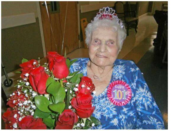 Cambridge House resident Ruth Nordwick on her 101th birthday with roses and a tiara