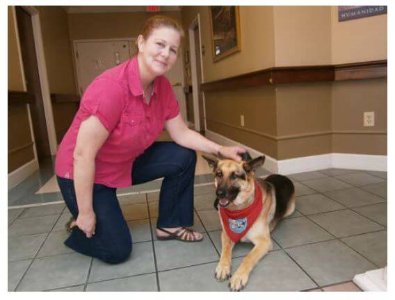 Karen Mielke of Statesville who visits Southfork once a month with her German Shepherd Cheyenne.