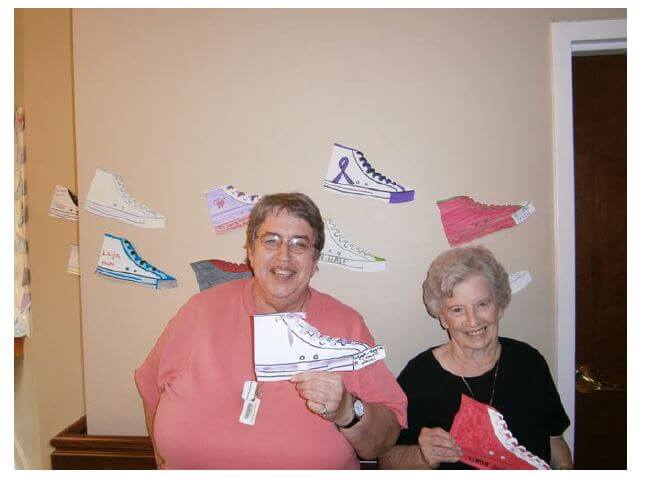 Southfork residents Judy Sink and Ruby Canter posing with some of the paper shoes available for $1 