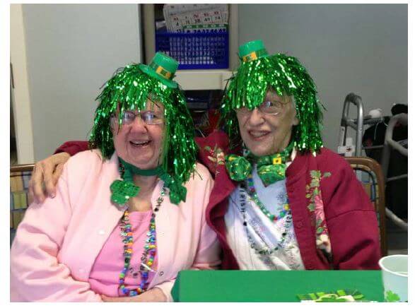 Roommates at Woodcrest Commons donned green wigs and other holiday-themed adornments