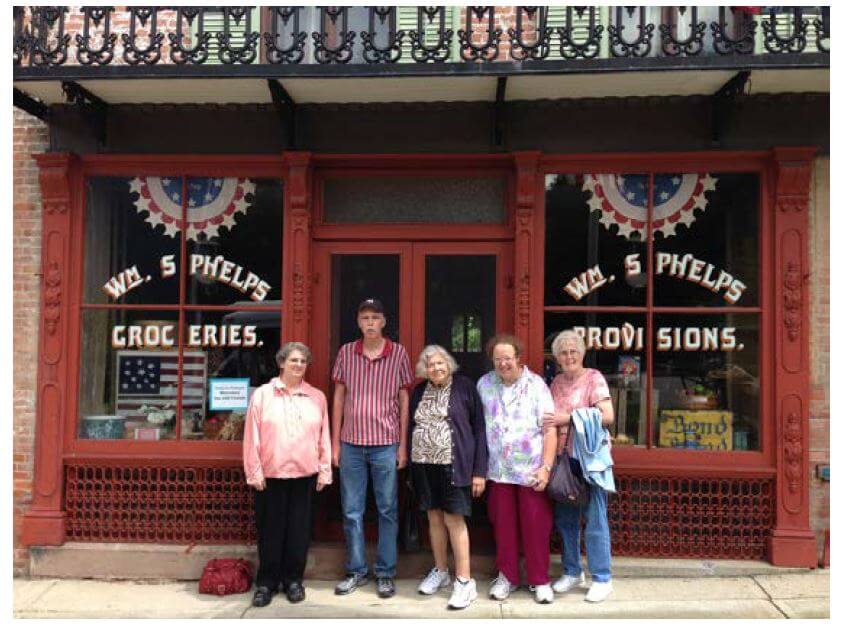 Woodcrest Commons residents in front of the general store 