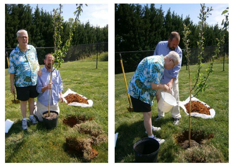 Wexford House resident Rick Taylor and Maintenance Director James Hall plant a yellow delicious apple tree in recognition of Arbor Day