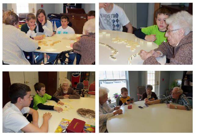 Ziegler brothers playing games with Westwood Commons residents for National Volunteer Week