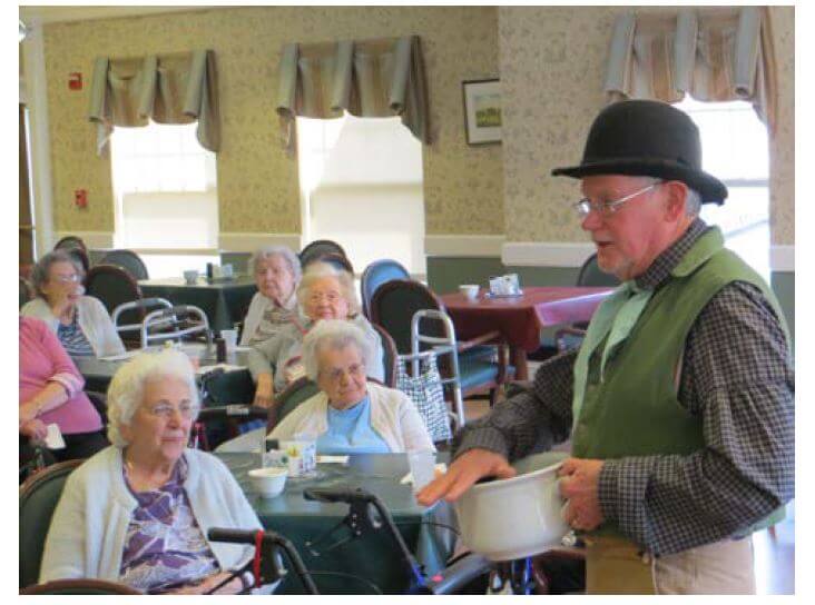 Historical reenactor Jim Brady from the Genesee Valley Country Museum performing for residents at westwood commons