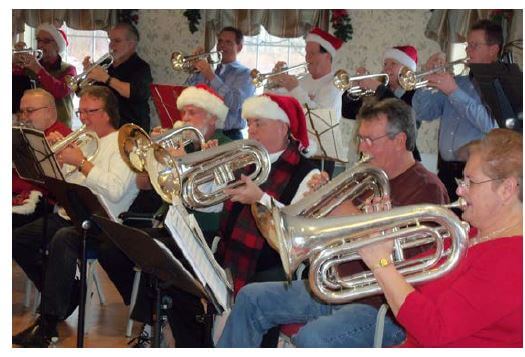 Christmas Brass the band performing for Westwood Commons residents