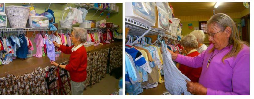  Wexford House residents Sarah Cooke and Lorene Cobb take down winter clothing and hang summer clothes at the East Lincoln Pregnancy Center