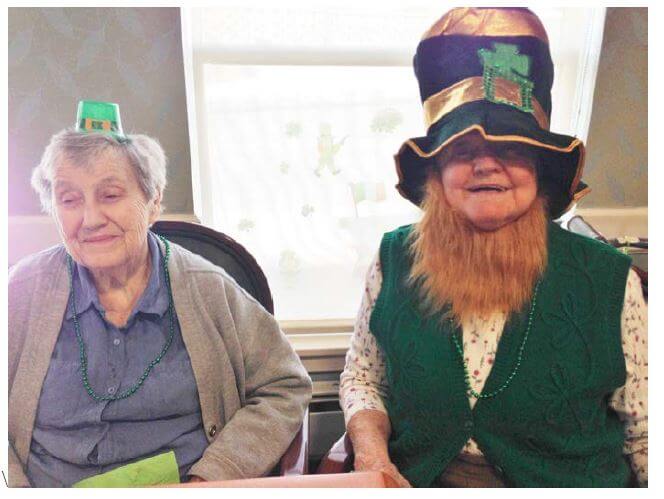 Woodcrest Commons residents Mary Male and Alma Coles share a laugh