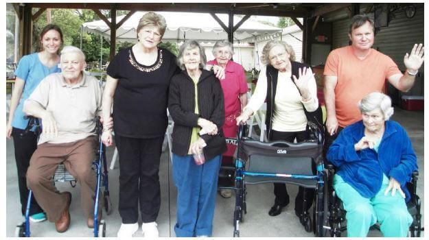 Woodridge Activities Director Brittany Plyler and residents Richard Marquard, Elizabeth Hess, Phyllis Cavender, Bonnie Outen, Hazel Broome and Shirley Ghant and her son Tommy Ghant