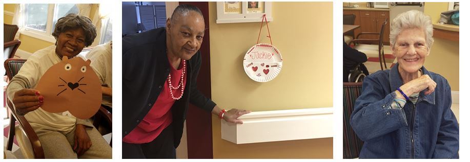  Woodridge resident Alma Anthony displays a handcrafted groundhog, Jackie Massey hangs a homemade Valentine’s Day card holder by her door and Carolyn Rawls shows off a bracelet she created during a craft activity