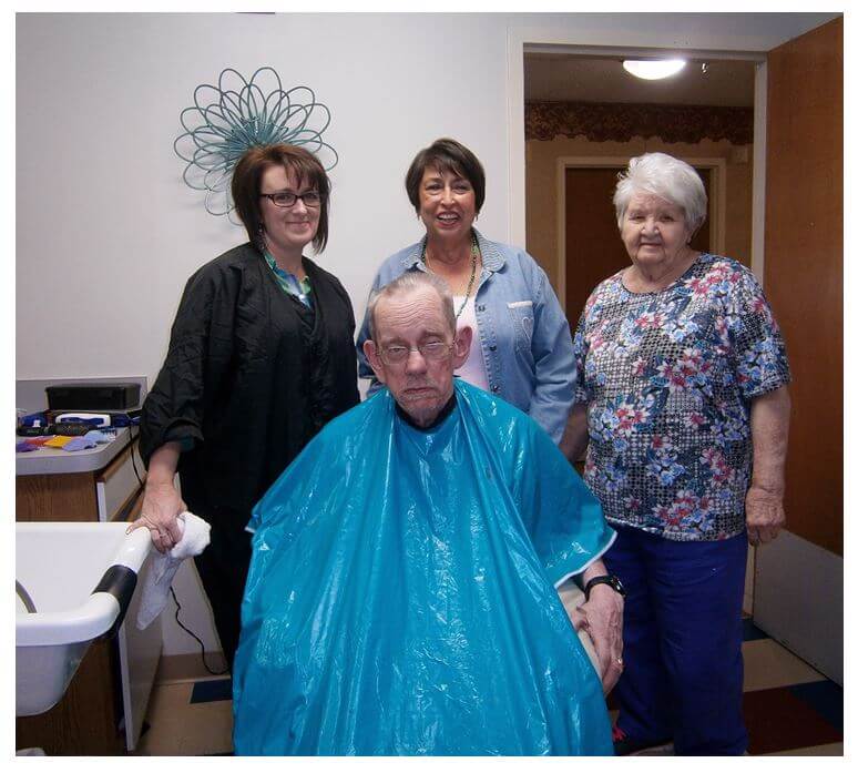 Malphrus is pictured with Wexford House residents Rose Wilson, Gladys Biddix and Tommy Ledford