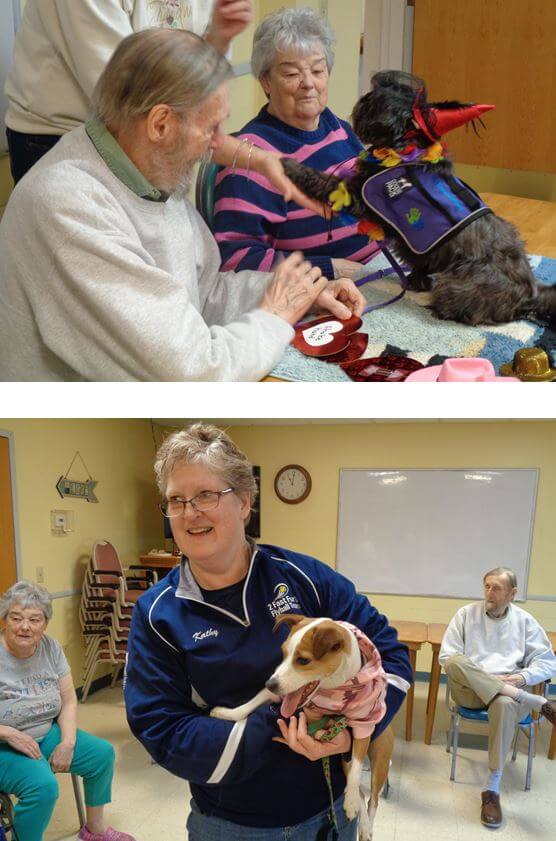 Horizons residents Bob Phillips and Shirley Carr delight in watching Betsy and Kathy Allen and her Jack Russell mix, Bea