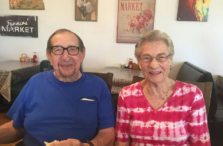 elderly couple sitting next to each other